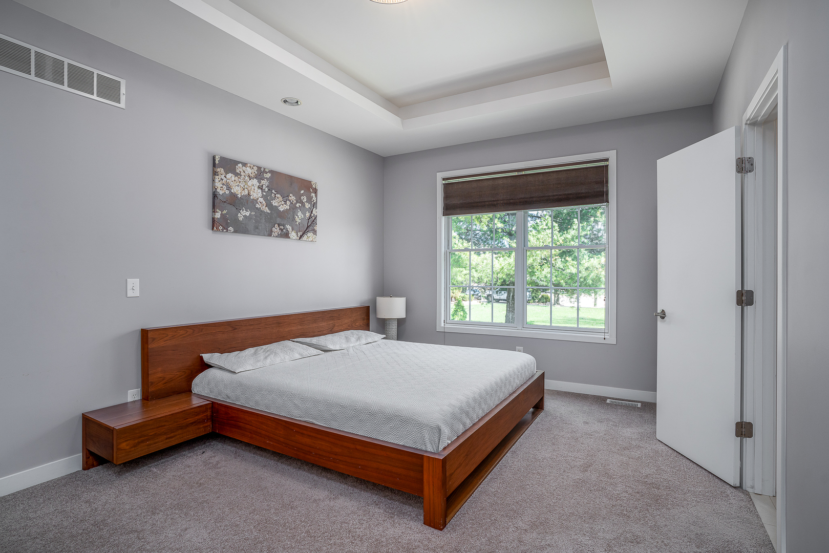 3404 77th St Court Moline, IL 61265 - Photo 19 of 37 a bed sitting in a bedroom next to a window