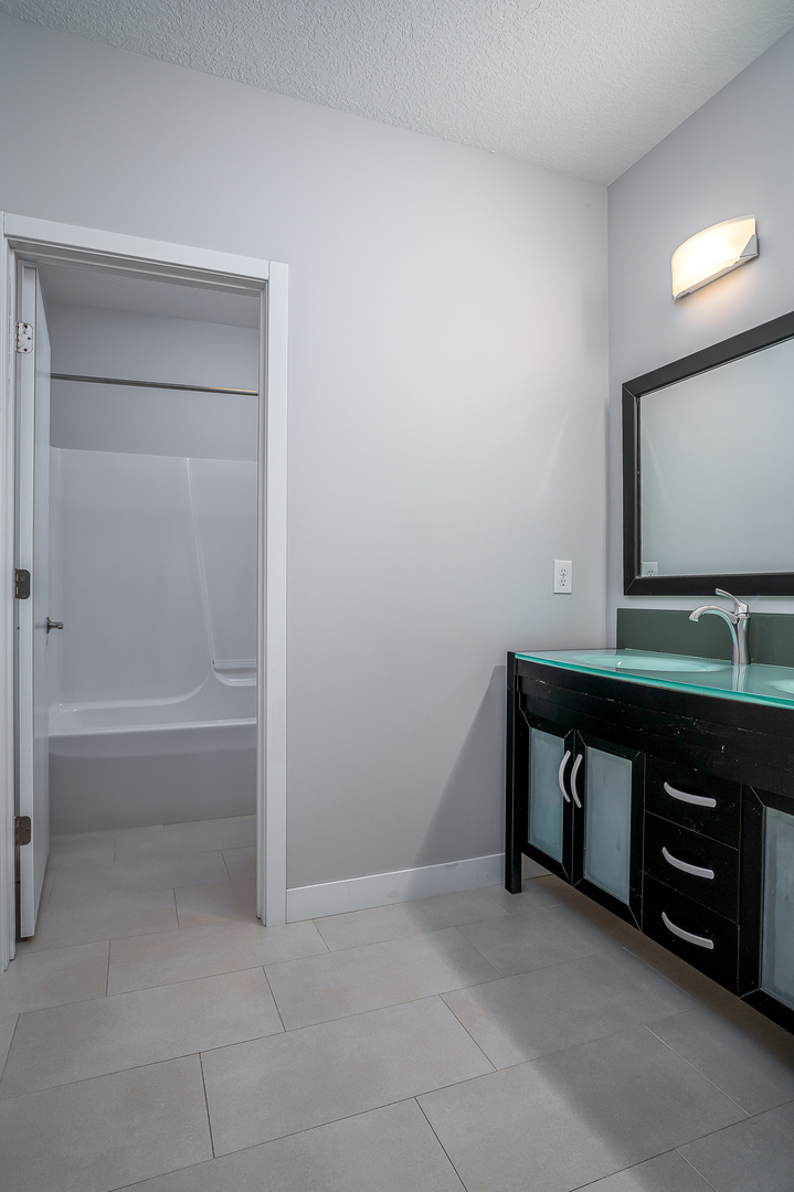 3404 77th St Court Moline, IL 61265 - Photo 29 of 37 a room with a sink and a mirror