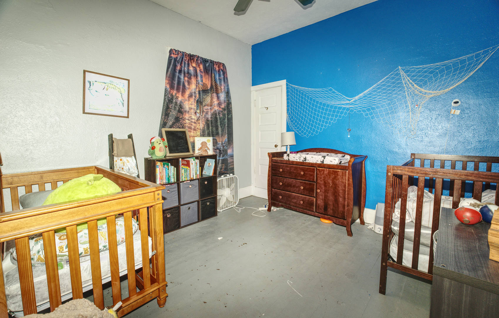 2108 Camanche Avenue Clinton, IA 52732 - Photo 11 of 22 a bedroom with furniture and baby crib