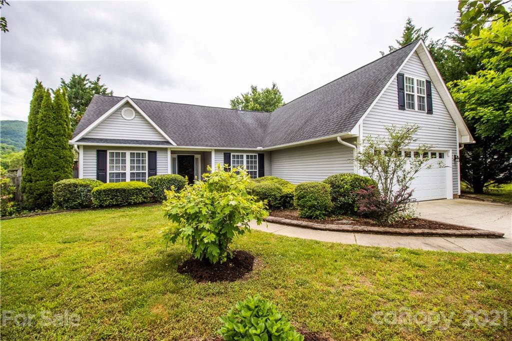 67 Rolling Meadow Road Fletcher, NC 28732 - Photo 1 of 39 a front view of a house with a yard