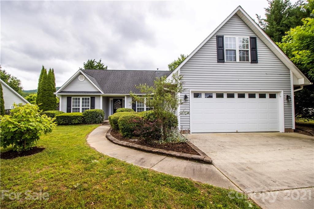 67 Rolling Meadow Road Fletcher, NC 28732 - Photo 2 of 39 a front view of a house with a yard and garage
