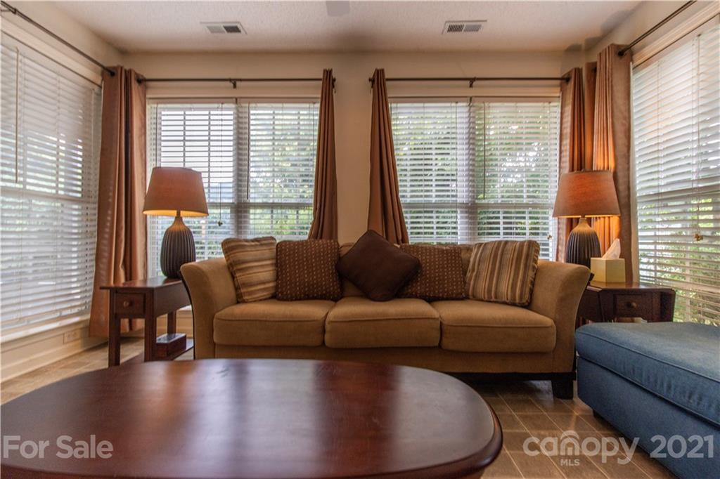 67 Rolling Meadow Road Fletcher, NC 28732 - Photo 11 of 39 a living room with furniture and a large window