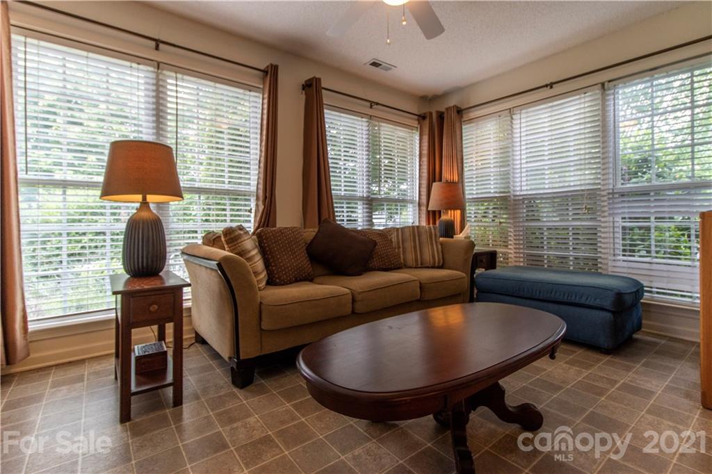 67 Rolling Meadow Road Fletcher, NC 28732 - Photo 12 of 39 a living room with furniture and a window