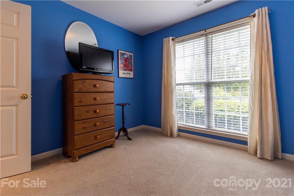 67 Rolling Meadow Road Fletcher, NC 28732 - Photo 20 of 39 a view of workspace with furniture and a flat screen tv