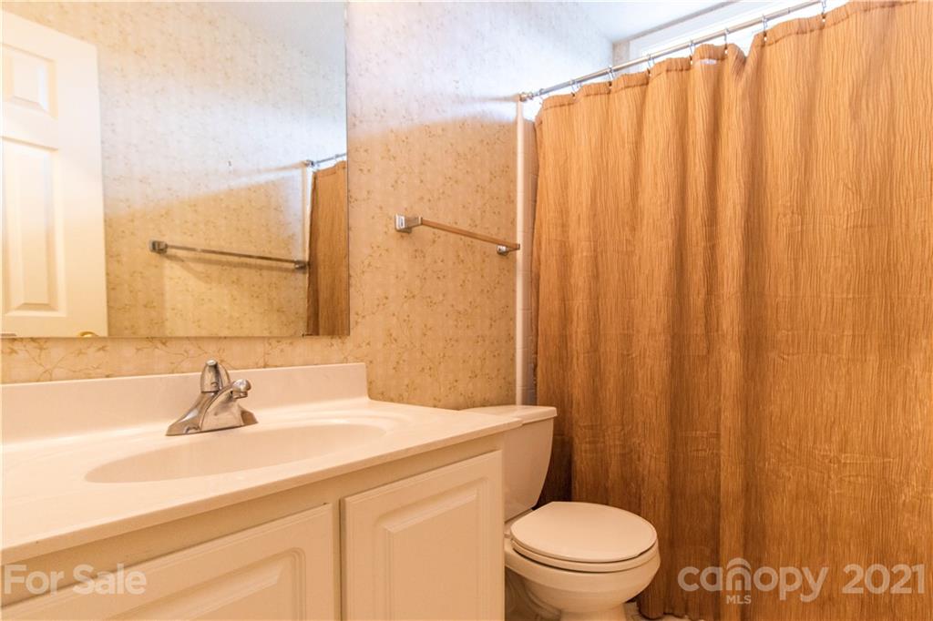 67 Rolling Meadow Road Fletcher, NC 28732 - Photo 22 of 39 a bathroom with a sink a toilet and shower