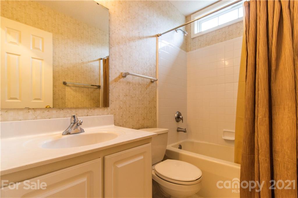 67 Rolling Meadow Road Fletcher, NC 28732 - Photo 23 of 39 a bathroom with a sink a toilet and shower