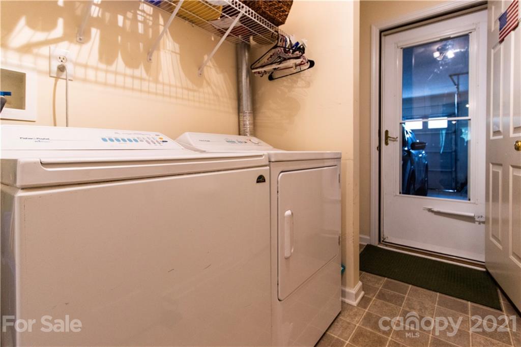 67 Rolling Meadow Road Fletcher, NC 28732 - Photo 29 of 39 a utility room with dryer and washer