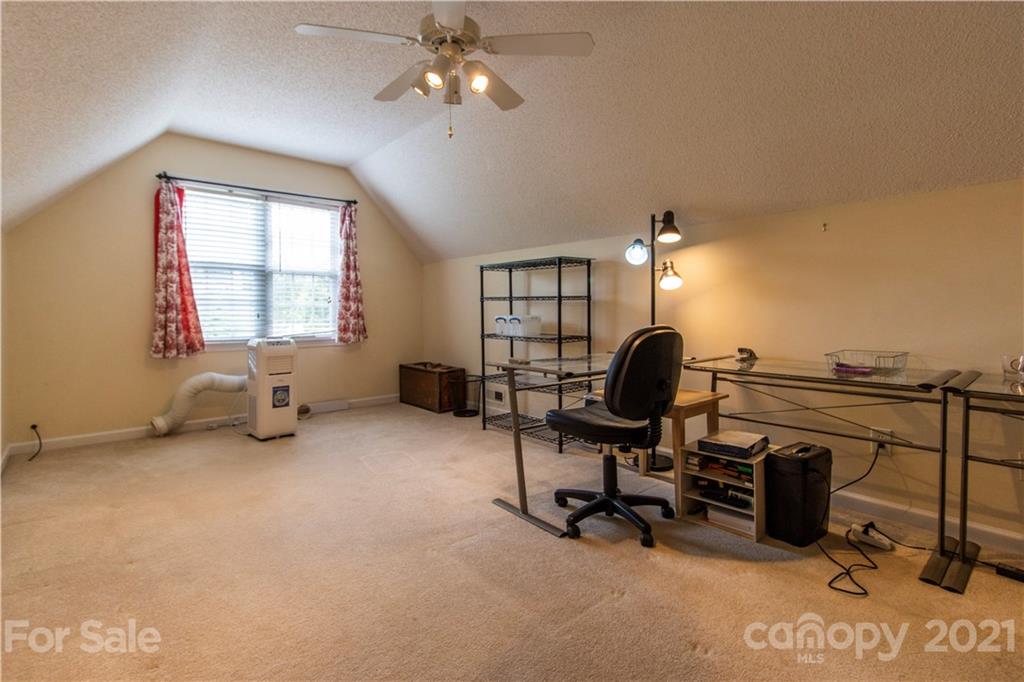 67 Rolling Meadow Road Fletcher, NC 28732 - Photo 31 of 39 a view of a workspace with furniture and a window