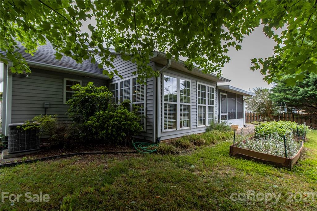 67 Rolling Meadow Road Fletcher, NC 28732 - Photo 35 of 39 a view of house with backyard and garden