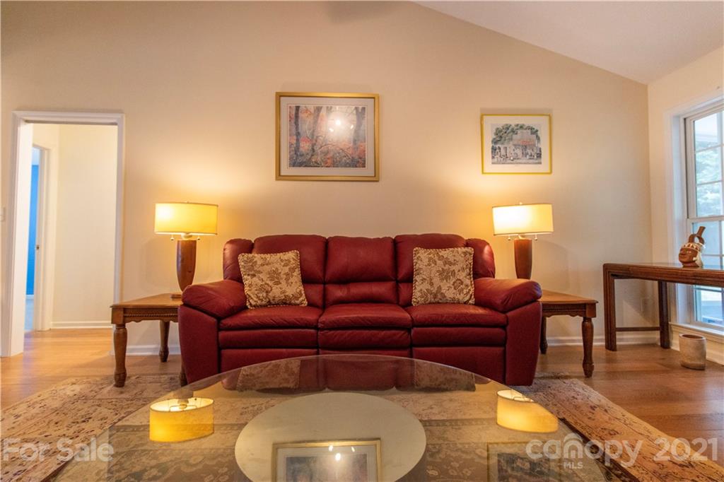 67 Rolling Meadow Road Fletcher, NC 28732 - Photo 5 of 39 a living room with furniture and a lamp