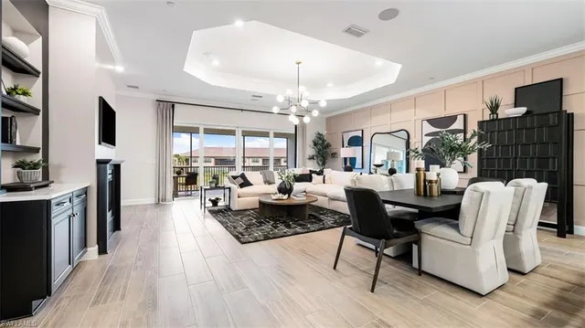 a living room with furniture fireplace and flat screen tv