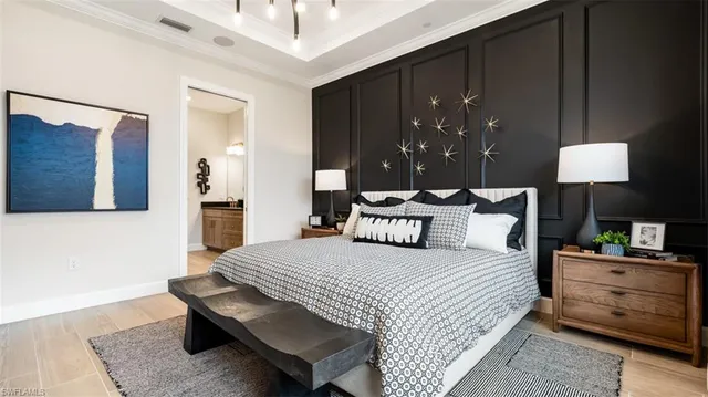 a bedroom with a bed and lamp with window