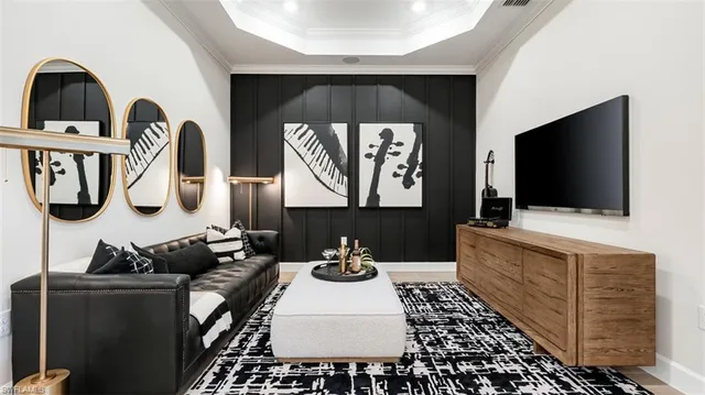 a living room with fireplace furniture and a flat screen tv