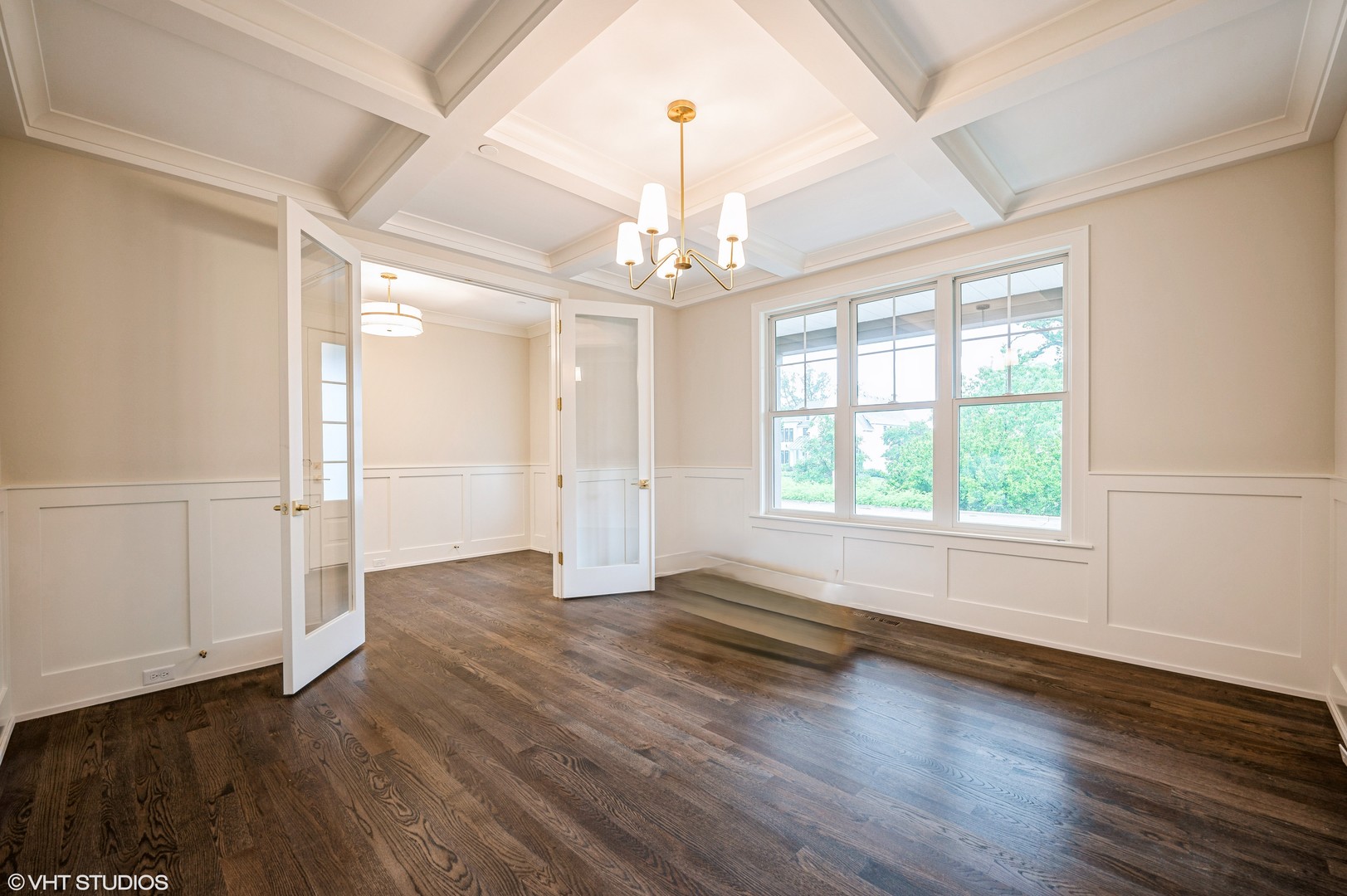 5903 Timber Trails Boulevard Western Springs, IL 60558 - Photo 3 of 30 an empty room with wooden floor chandelier and windows