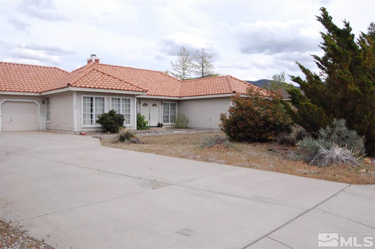 1195 High Chaparral Drive Reno, NV 89521 - Photo 1 of 1 a backyard of a house with table and chairs
