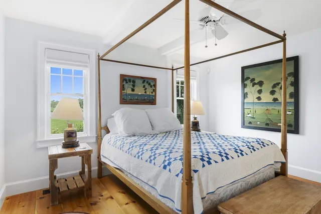 a bedroom with a bed and a desk