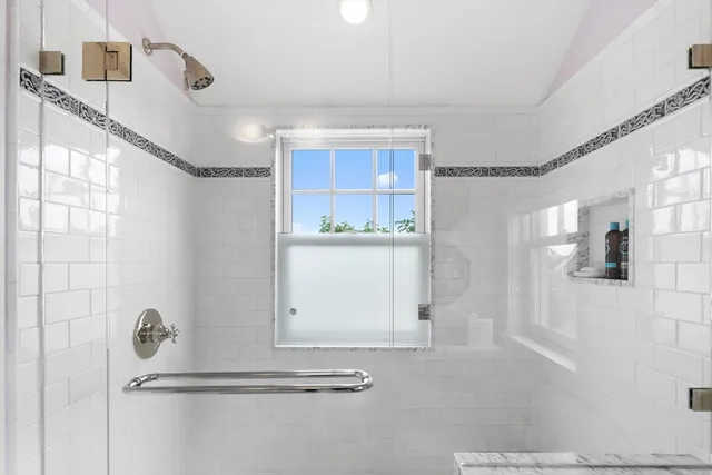 a bathroom with a sink and mirror