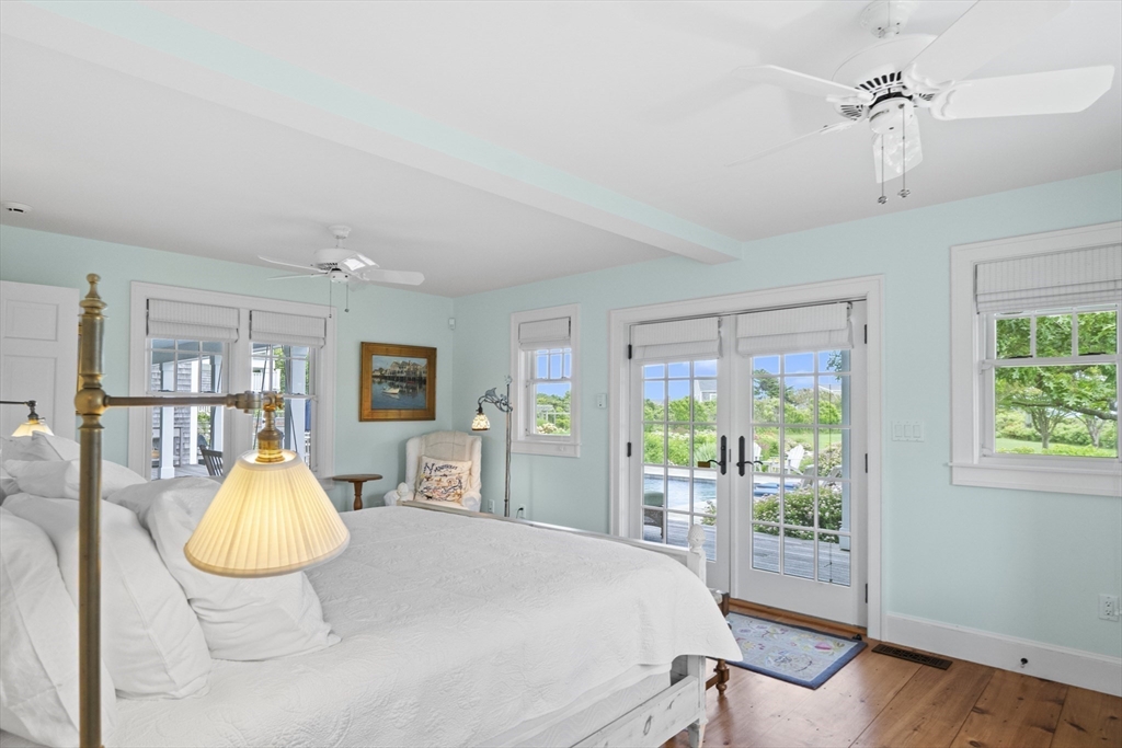 28 Bosworth Road Nantucket, MA 02554 - Photo 16 of 34 a bedroom with a bed and wooden floor