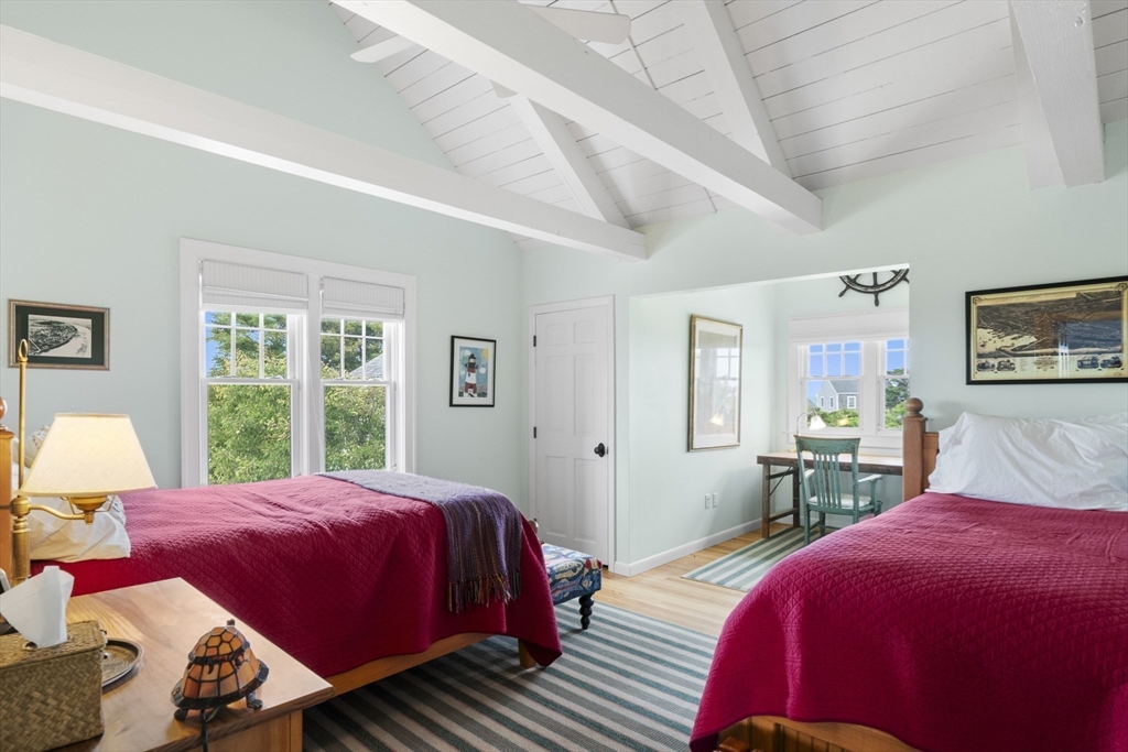 28 Bosworth Road Nantucket, MA 02554 - Photo 18 of 34 a bedroom with a bed and wooden floor