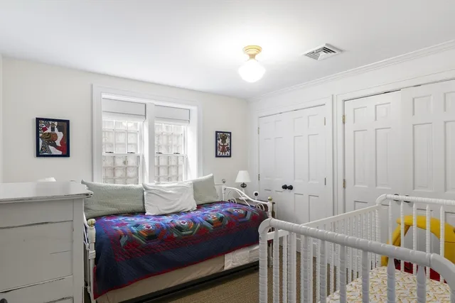 a bedroom with furniture and a window