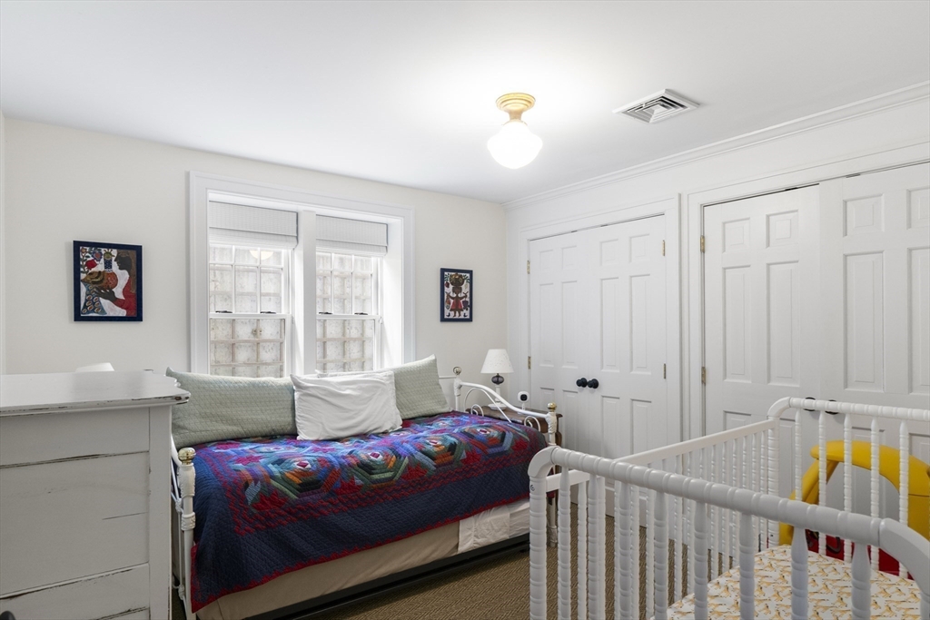 28 Bosworth Road Nantucket, MA 02554 - Photo 19 of 34 a bedroom with furniture and a window