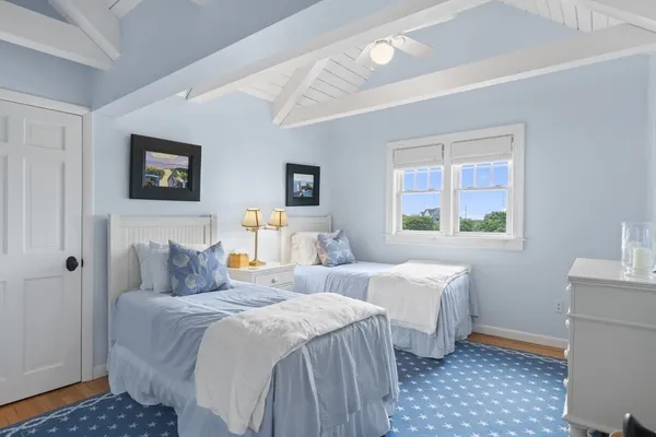 a bedroom with double bed and a window