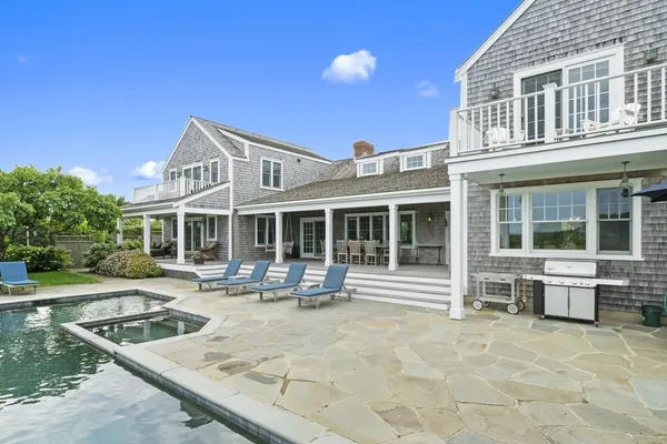 a front view of house with outdoor seating