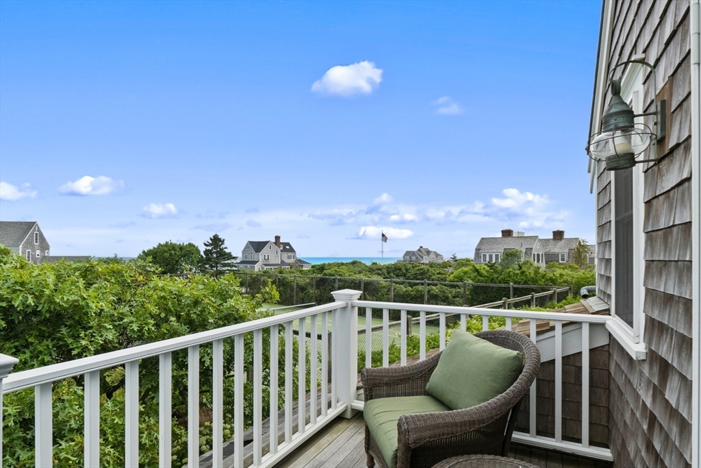 28 Bosworth Road Nantucket, MA 02554 - Photo 10 of 34 a balcony with wooden floor and outdoor space