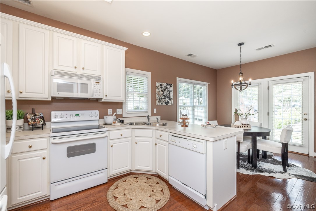 2152 Magnolia Grove Way, Unit 2152 Midlothian, VA 23113 - Photo 11 of 38 a kitchen with a sink stove and cabinets