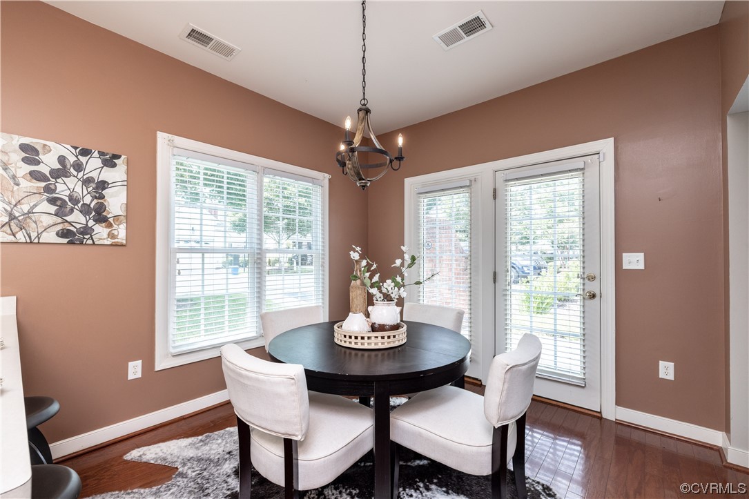 2152 Magnolia Grove Way, Unit 2152 Midlothian, VA 23113 - Photo 15 of 38 a dining room with furniture a chandelier and wooden floor