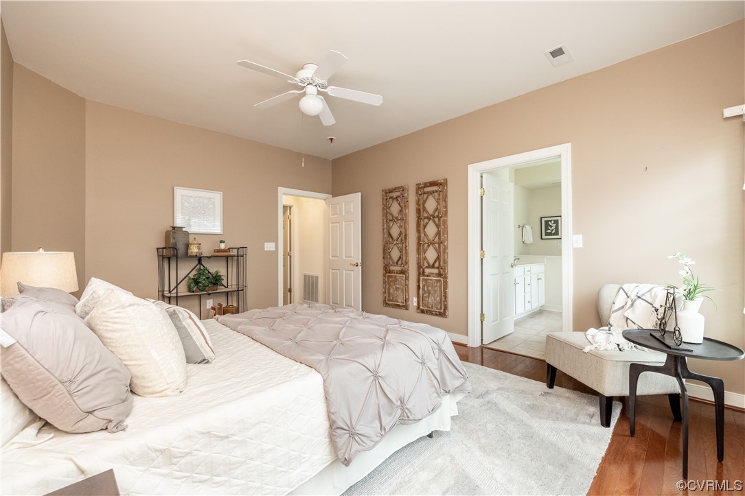 2152 Magnolia Grove Way, Unit 2152 Midlothian, VA 23113 - Photo 19 of 38 a spacious bedroom with a bed and a chandelier