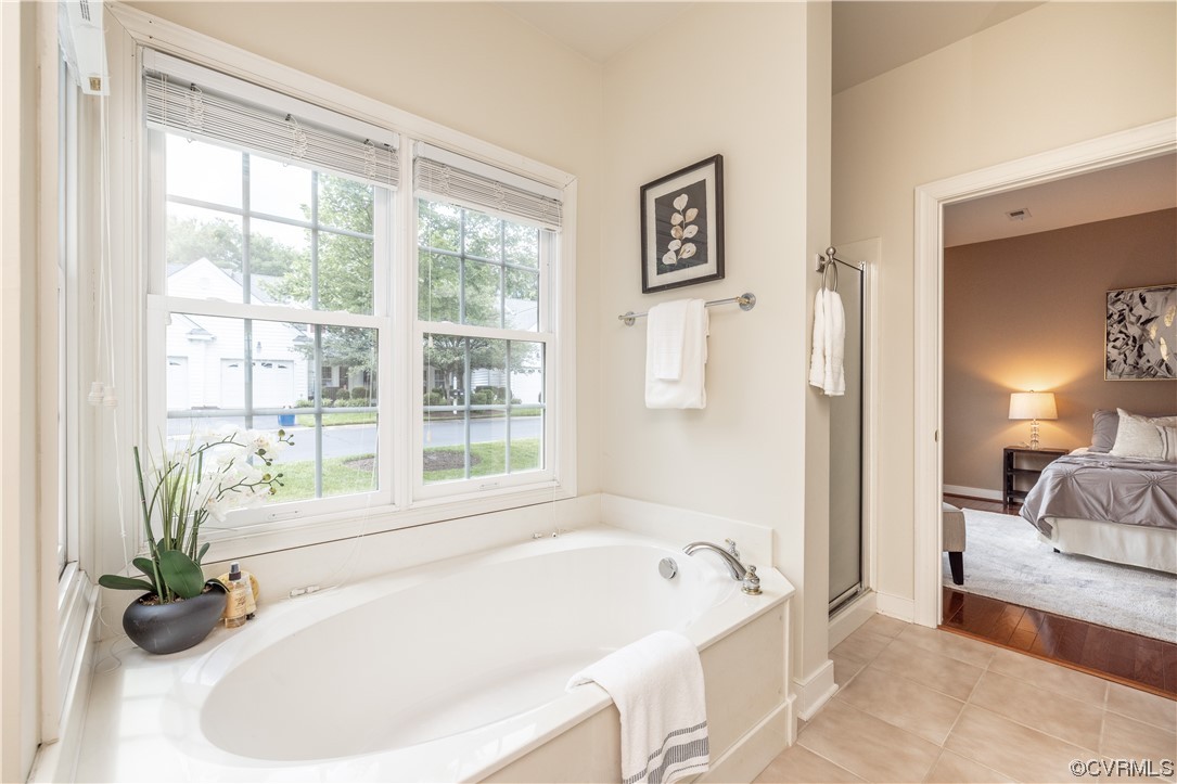 2152 Magnolia Grove Way, Unit 2152 Midlothian, VA 23113 - Photo 20 of 38 a white bath tub sitting next to a window