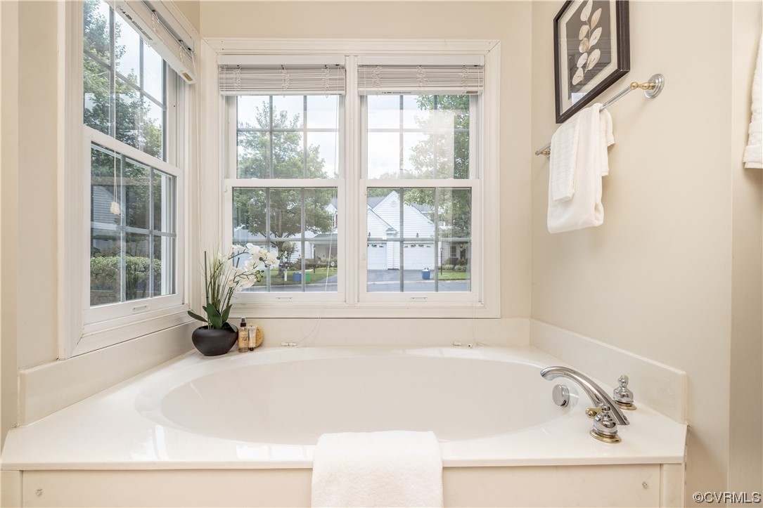 2152 Magnolia Grove Way, Unit 2152 Midlothian, VA 23113 - Photo 23 of 38 a bathroom with a bathtub and a window