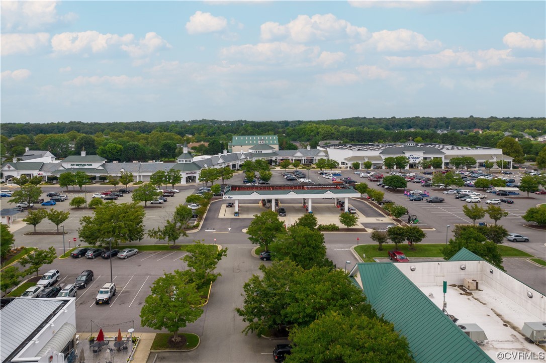 2152 Magnolia Grove Way, Unit 2152 Midlothian, VA 23113 - Photo 34 of 38 an aerial view of a city with lots of residential buildings ocean and mountain view in back