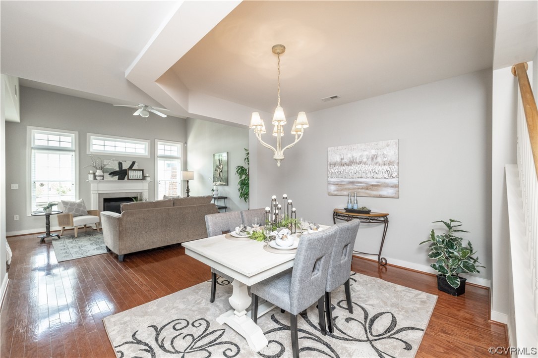 2152 Magnolia Grove Way, Unit 2152 Midlothian, VA 23113 - Photo 4 of 38 a view of a dining room with furniture wooden floor and a chandelier