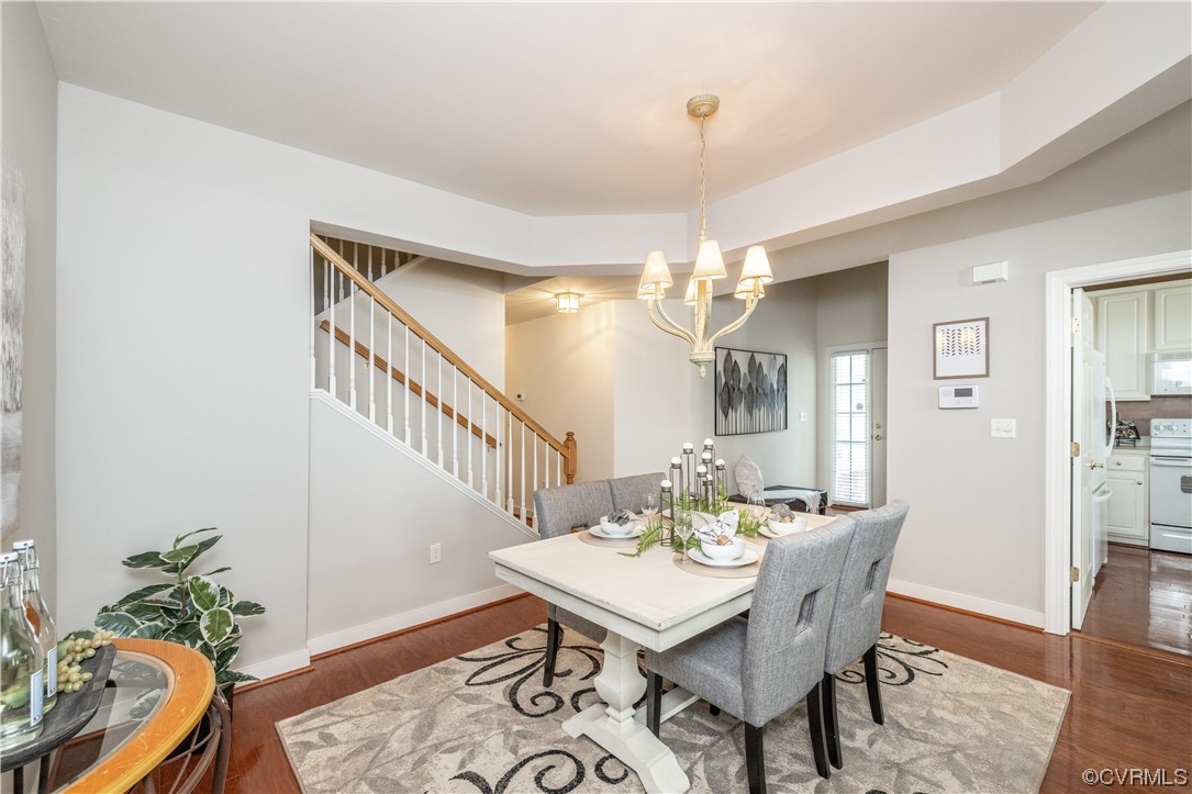 2152 Magnolia Grove Way, Unit 2152 Midlothian, VA 23113 - Photo 10 of 38 a view of a dining room with furniture and wooden floor