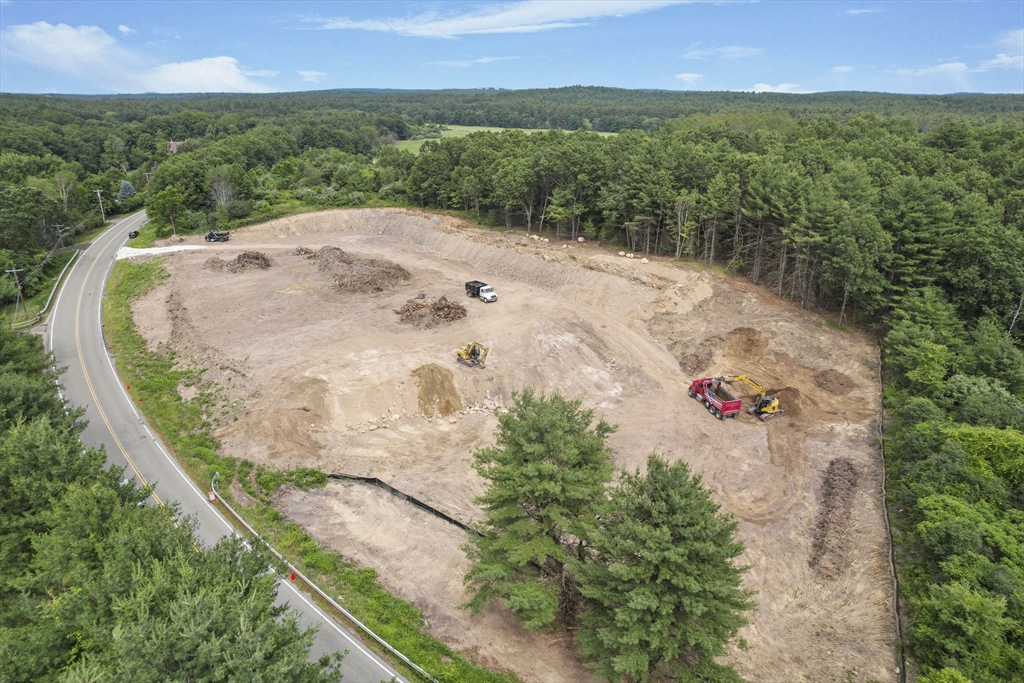 147 Nashua Road Pepperell, MA 01463 - Photo 2 of 11 an aerial view of a house with a yard and lake