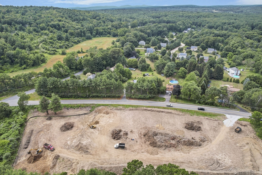 147 Nashua Road Pepperell, MA 01463 - Photo 4 of 11 an aerial view of a house with a yard