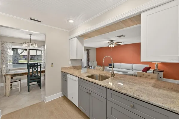 a kitchen with a sink and cabinets