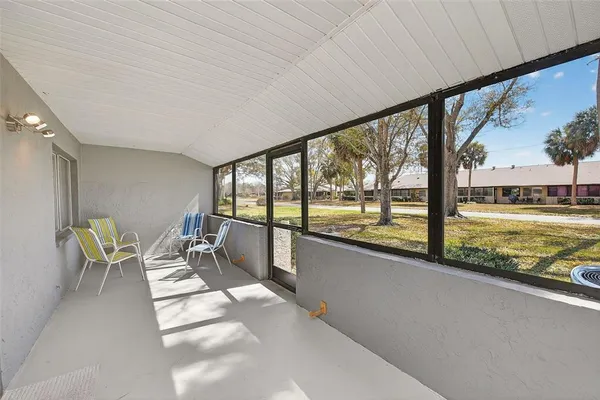 a view of a city from a dining room with large windows