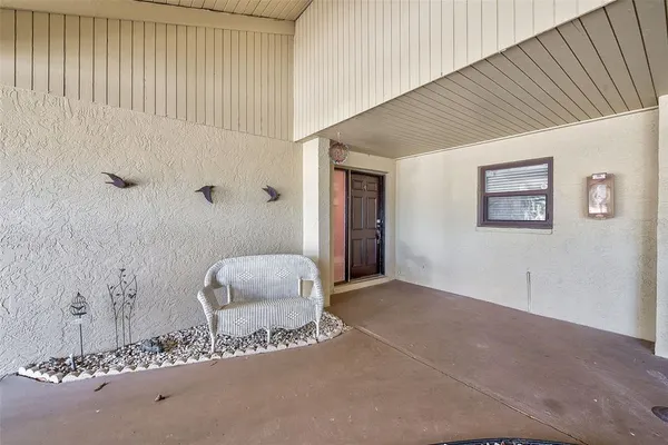 a bathroom with a window and a shower