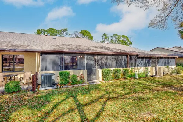 a view of a dinning table and chairs in patio