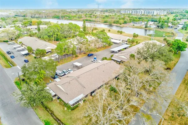 an aerial view of residential houses with outdoor space