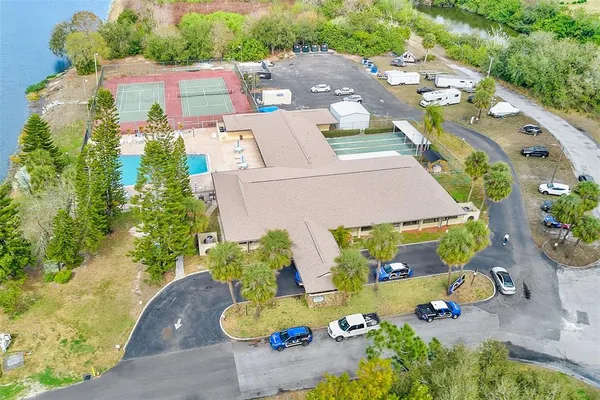 an aerial view of a house with a yard basket ball court