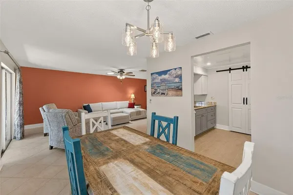 a very nice looking dining room with a table and chairs