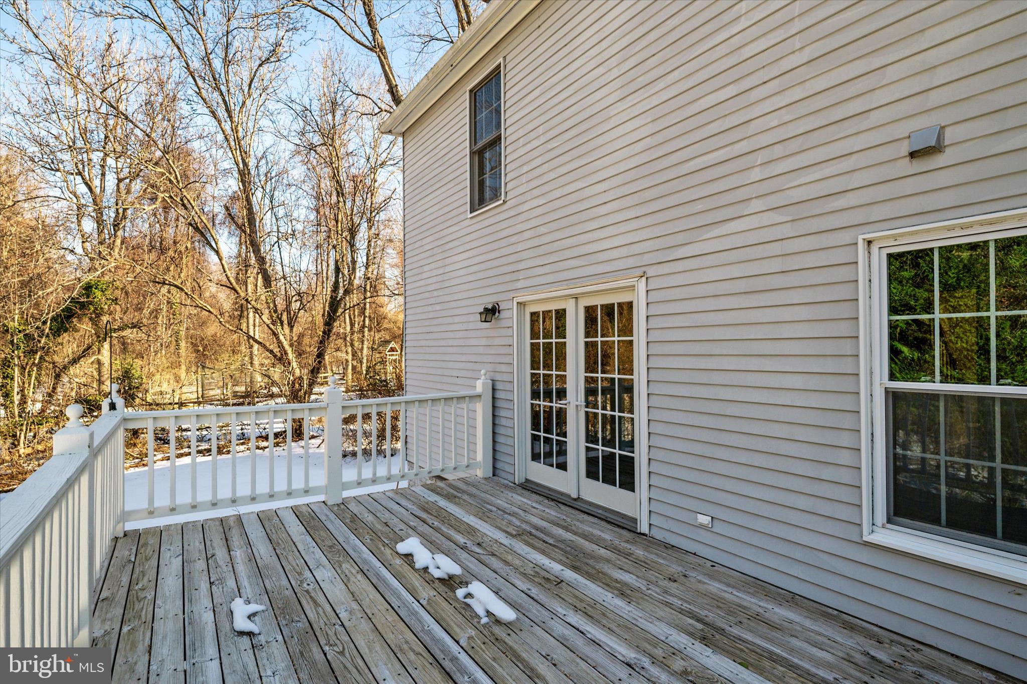 303 Pytchley Run Annapolis, MD 21403 - Photo 12 of 42 a view of a wooden deck with a yard