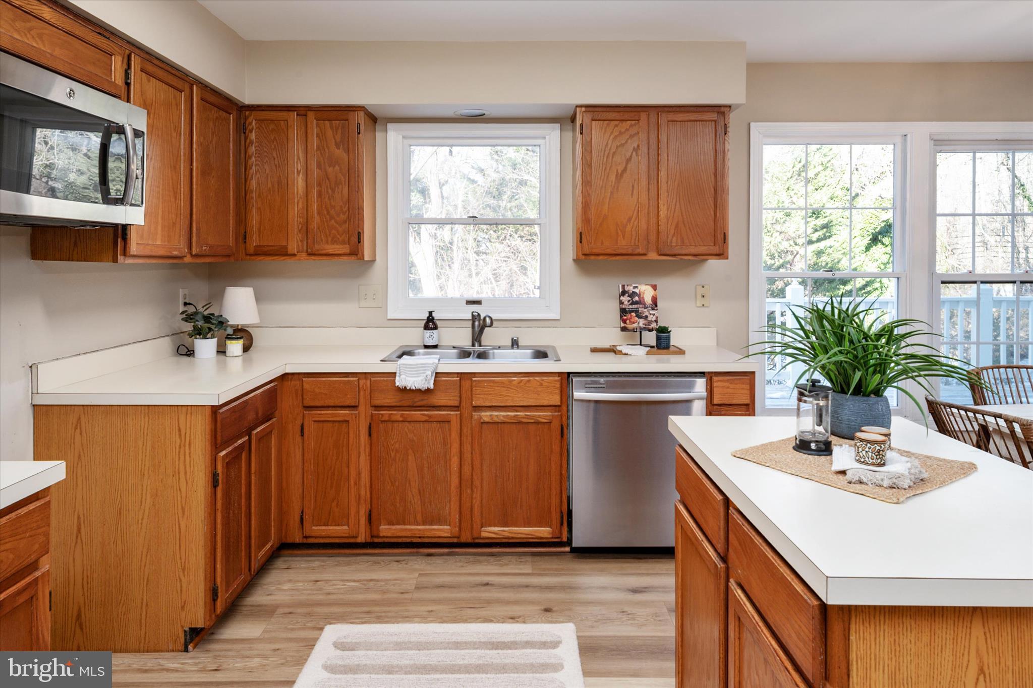 303 Pytchley Run Annapolis, MD 21403 - Photo 16 of 42 a kitchen with a sink cabinets and window