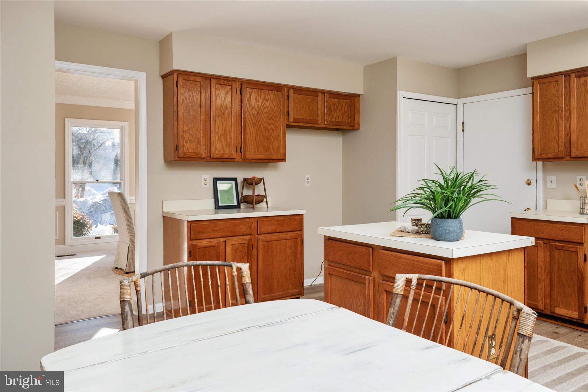 303 Pytchley Run Annapolis, MD 21403 - Photo 17 of 42 a kitchen with stainless steel appliances kitchen island granite countertop a sink a stove and a wooden cabinets