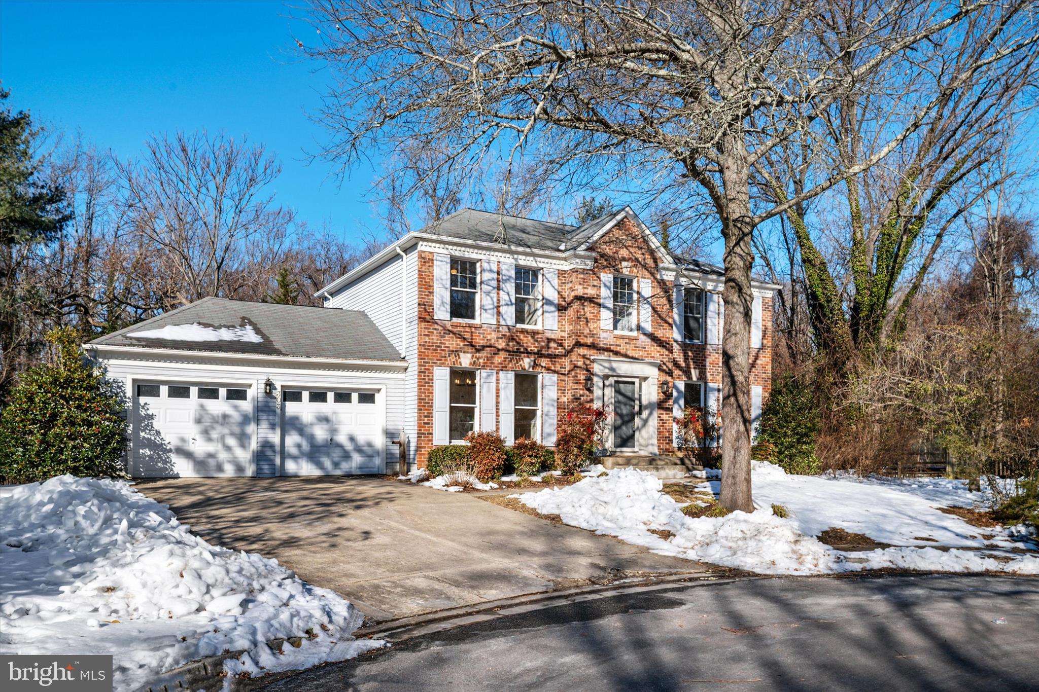 303 Pytchley Run Annapolis, MD 21403 - Photo 2 of 42 a view of a white house with a yard covered in snow
