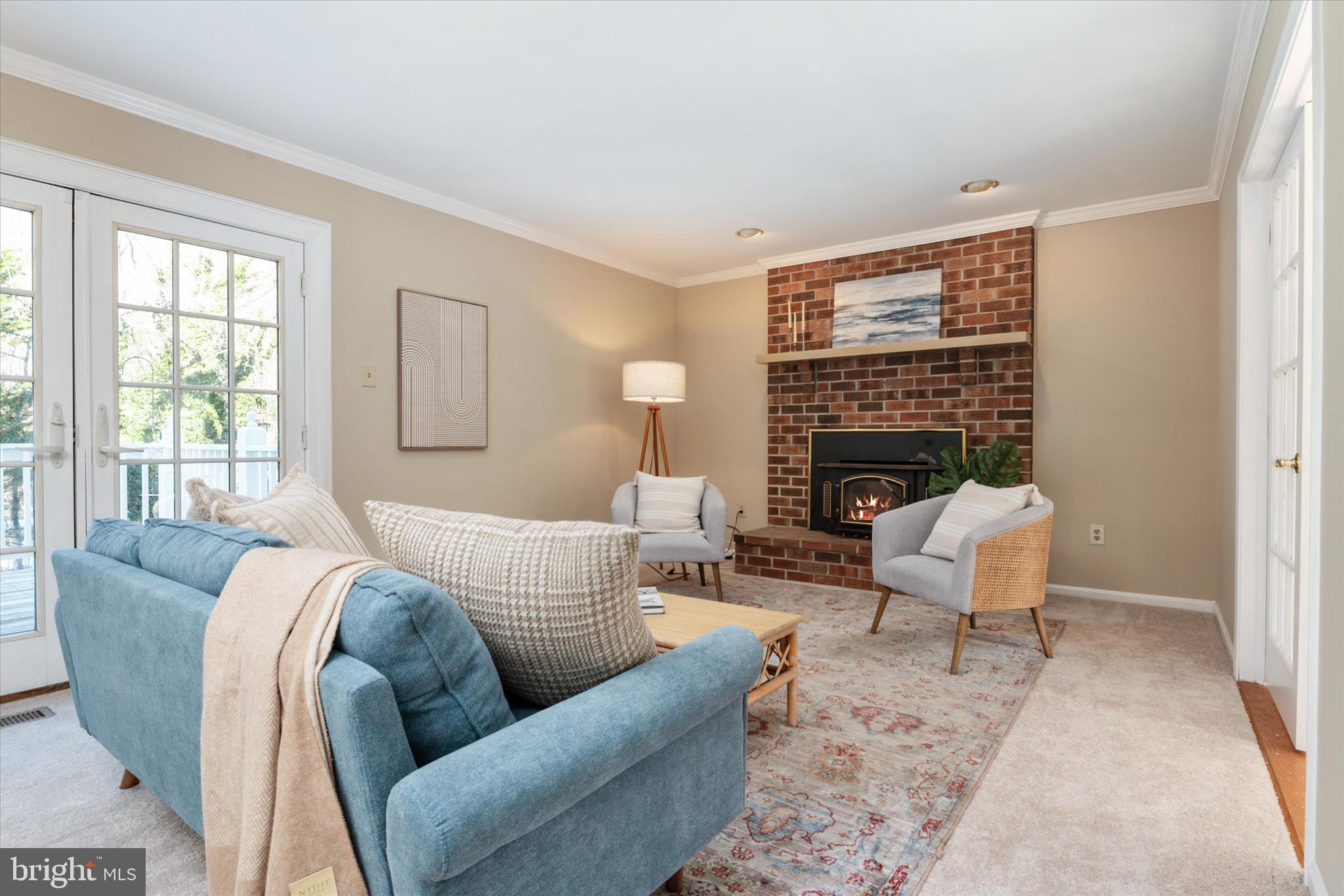 303 Pytchley Run Annapolis, MD 21403 - Photo 9 of 42 a living room with furniture a fireplace and a table